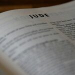 a bible opened to the book of Jude