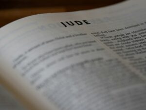 a bible opened to the book of Jude