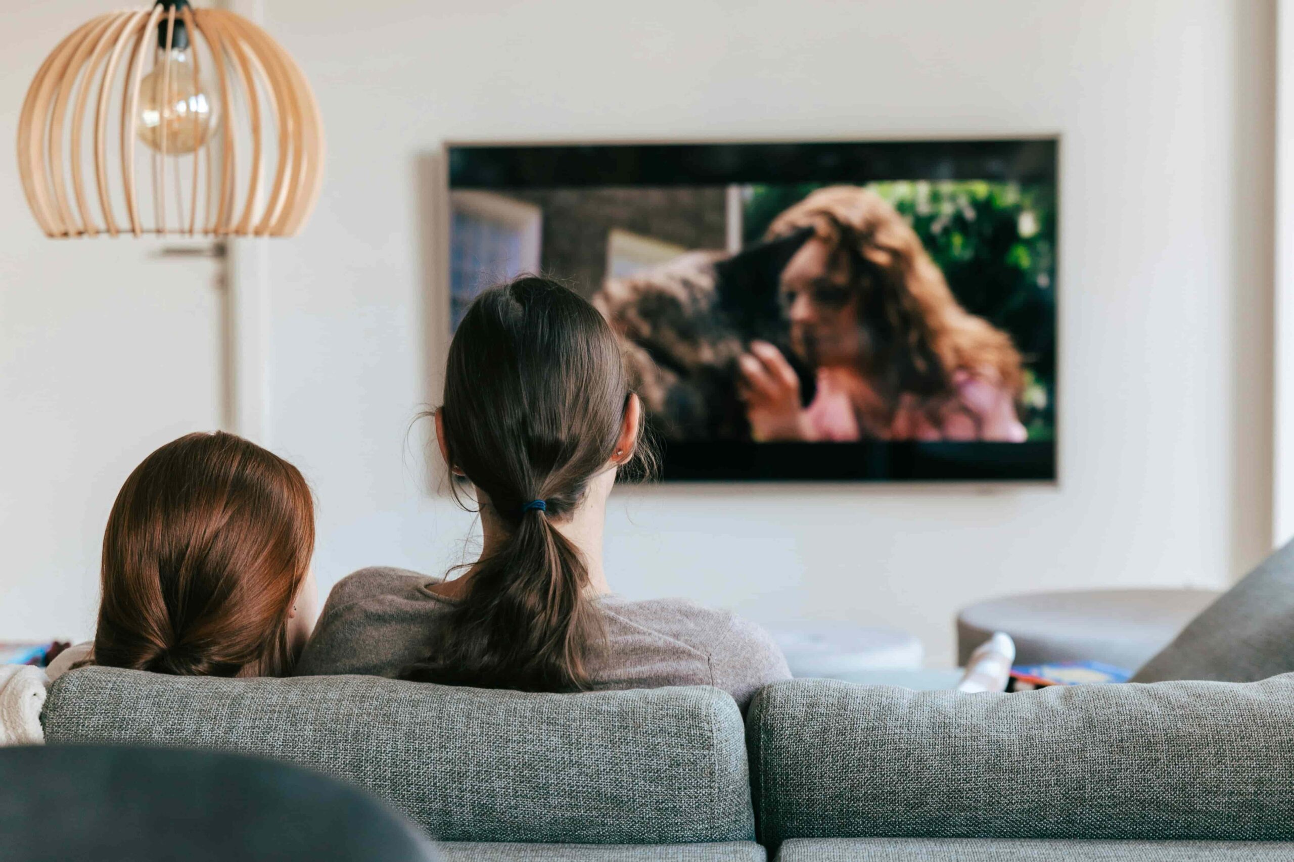 two people watching tv